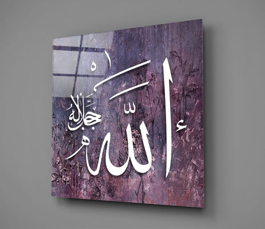 Purple weathered Allah calligraphy glass wall art hanging on a plain gray wall, seen at an angle