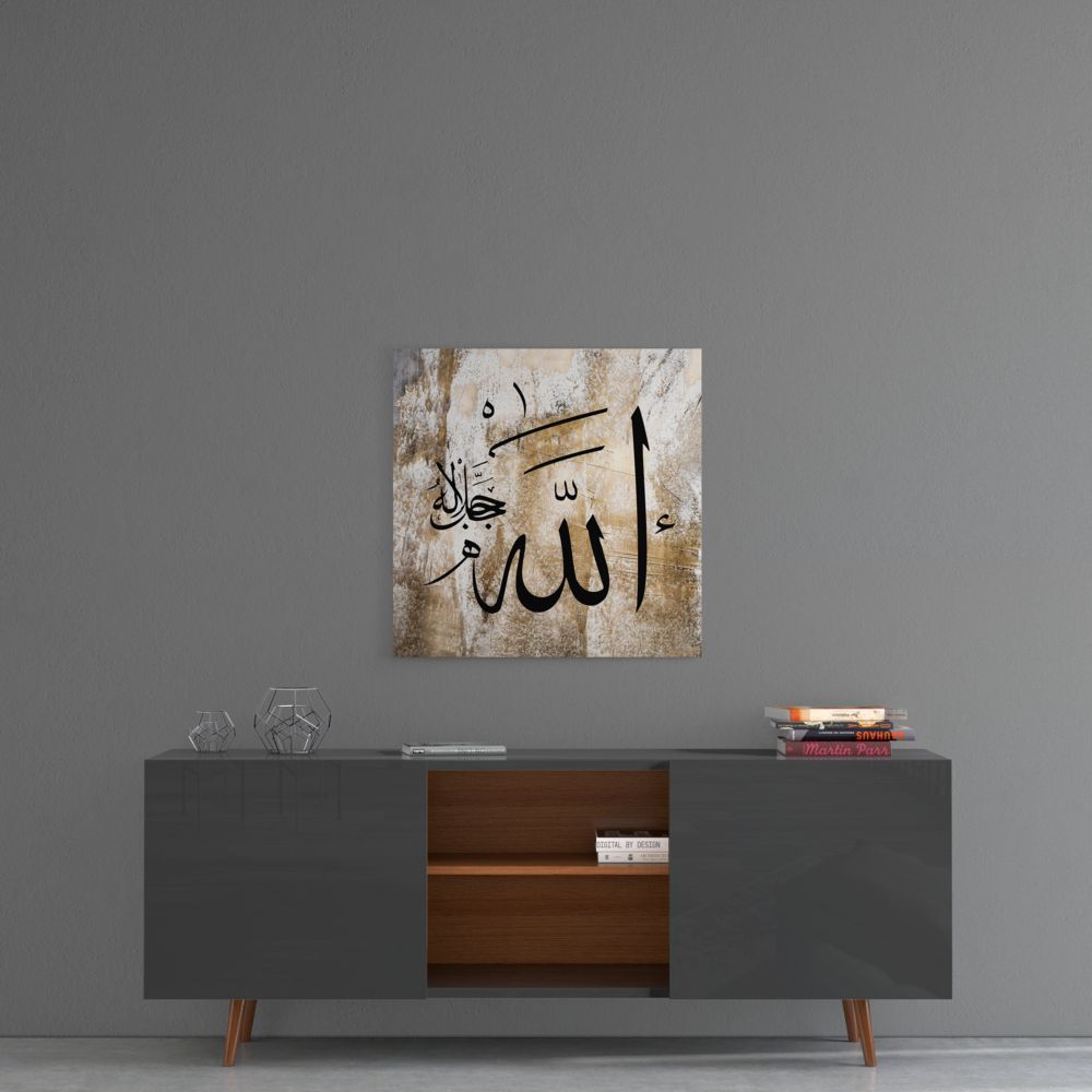 Weathered beige Allah calligraphy glass wall art above a gray sideboard with a wooden center shelf