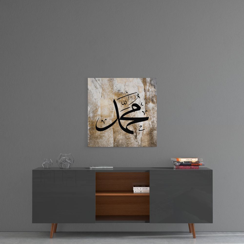Weathered beige Muhammad calligraphy glass wall art above a gray sideboard with a wooden center shelf