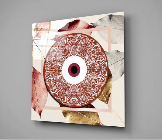 Red evil eye mandala glass wall art hanging on a gray wall