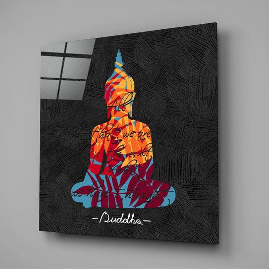 Buddha quote on black square glass wall art on a gray wall with a window reflection in the glass
