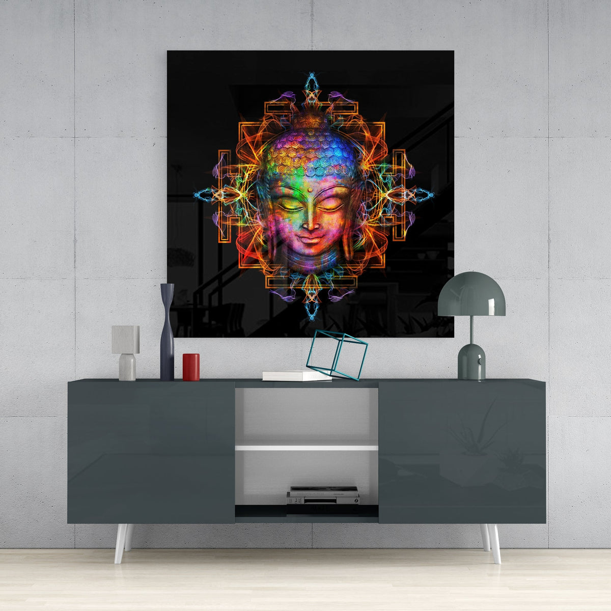 Rainbow Buddha mandala square glass wall art on a concrete wall above a dark gray sideboard
