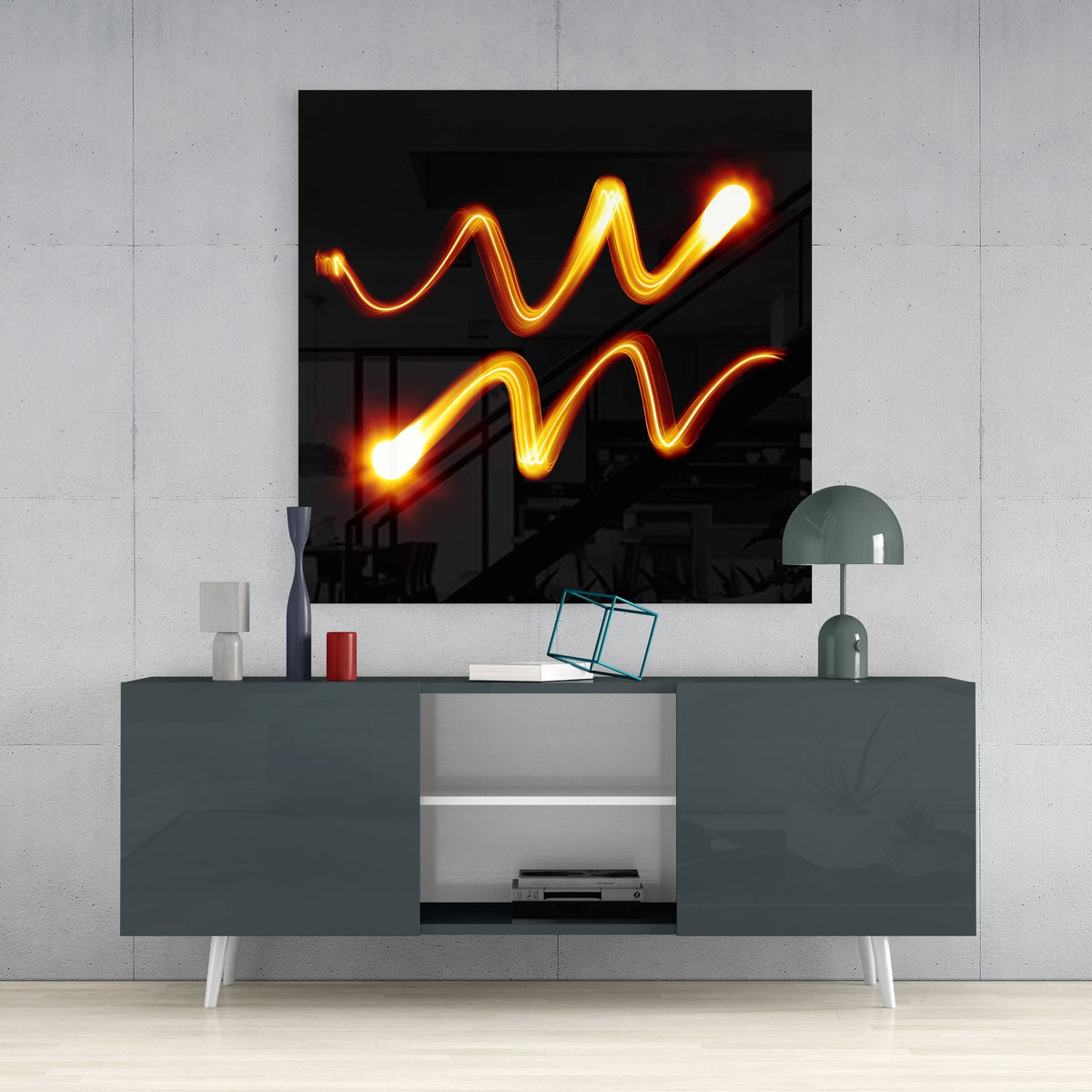 Aquarius light trail glass wall art above a dark gray sideboard with a dome lamp and a teal wire cube