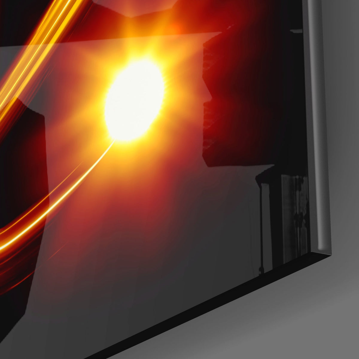 Close-up of the glossy tempered glass edge of the amber light Virgo symbol piece