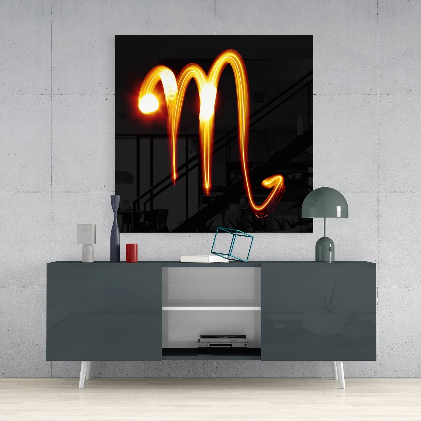 Scorpio light trail glass wall art above a dark gray sideboard with a dome lamp and a teal wire cube