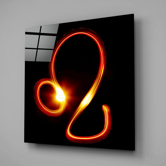 Leo light trail glass wall art on a gray wall with a window reflected in the glossy black front