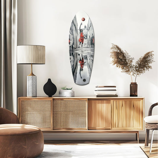 Street basketball surfboard glass wall art above a rattan sideboard with a lamp and pampas grass