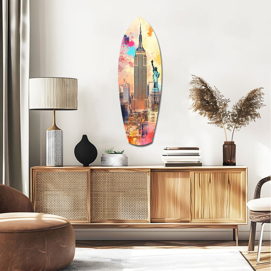 New York skyline surfboard glass wall art above a rattan sideboard with a table lamp and pampas grass