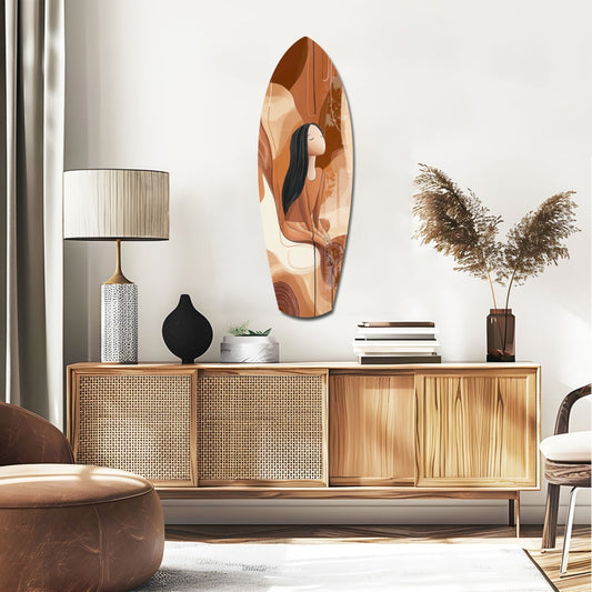 Terracotta Woman With Long Hair surfboard glass wall art above a rattan sideboard with a table lamp and pampas grass