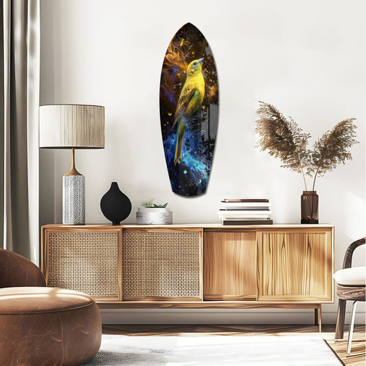 Yellow songbird surfboard glass wall art above a rattan sideboard with a table lamp and pampas grass