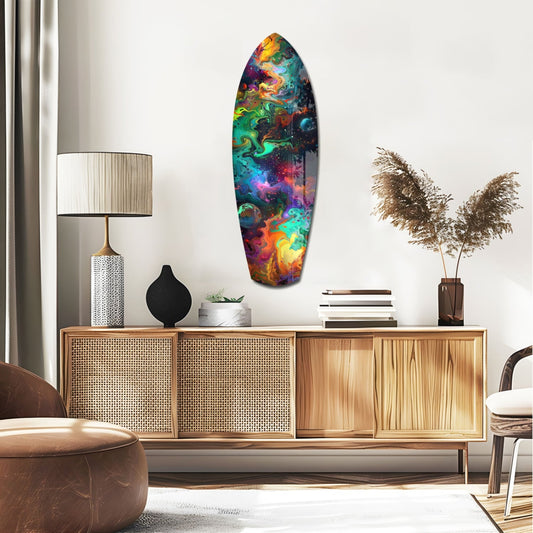 Rainbow marbled nebula surfboard glass wall art above a rattan sideboard with a table lamp and pampas grass