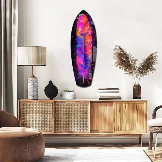 Neon feather surfboard glass wall art above a rattan sideboard with a table lamp and pampas grass