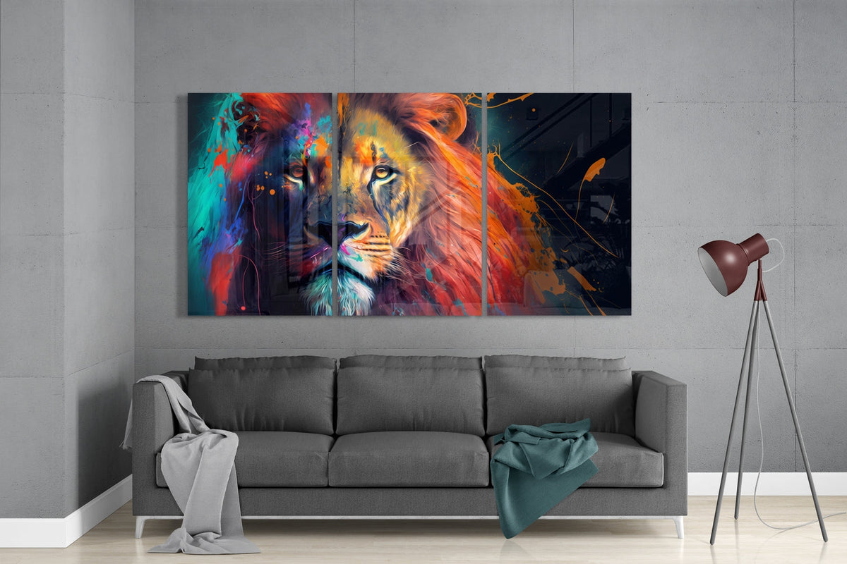 Lion in teal and orange paint 3-panel glass wall art set above a gray sofa beside a tripod floor lamp