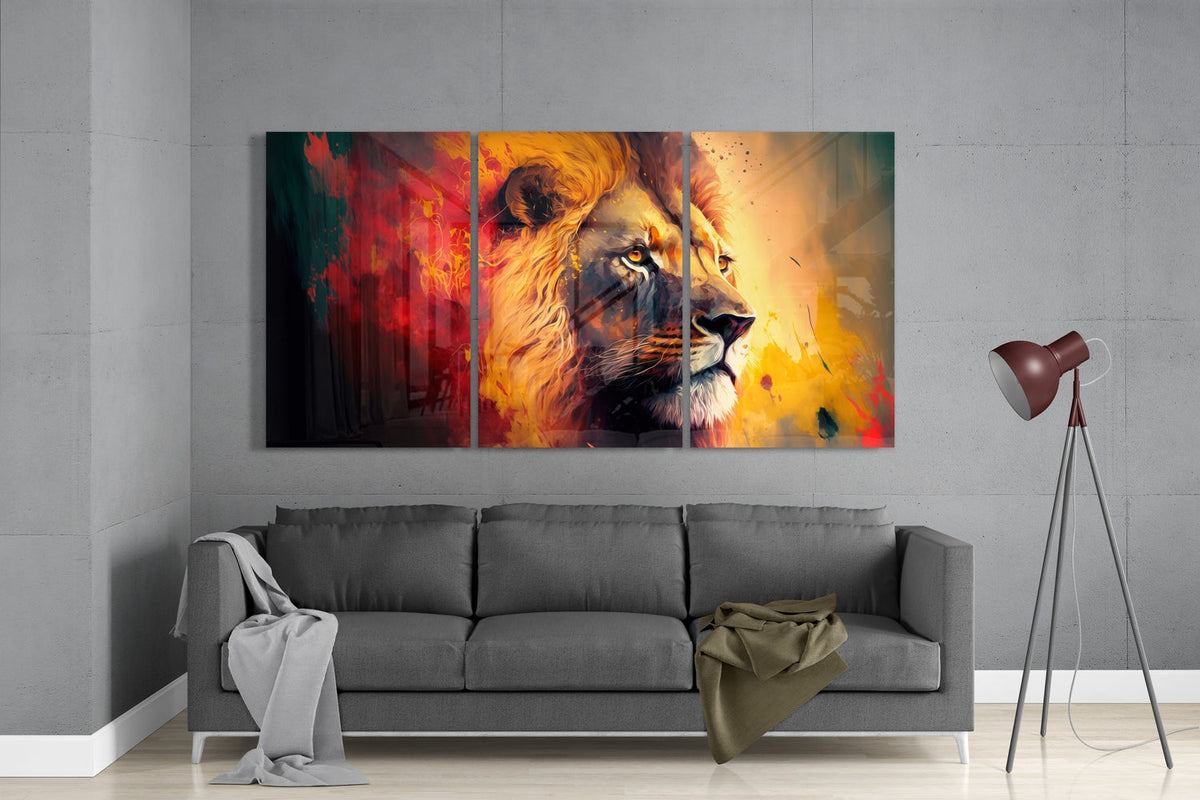 Lion in red and yellow paint 3-panel glass wall art set above a gray sofa beside a tripod floor lamp