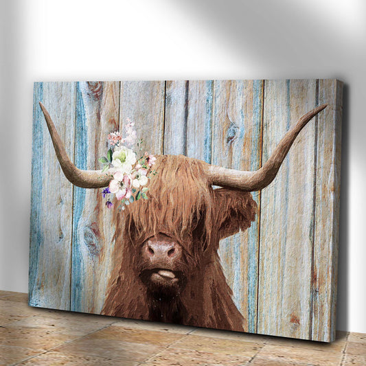 Angled view of the highland cow with flower crown canvas leaning against a white wall
