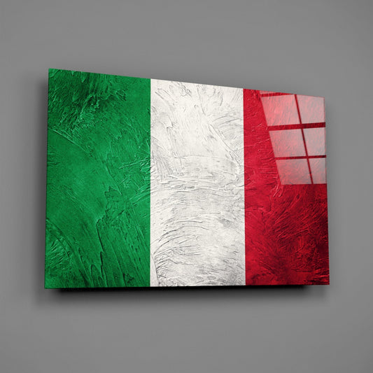 Weathered Italy flag glass wall art on a gray wall, light catching the glossy glass surface