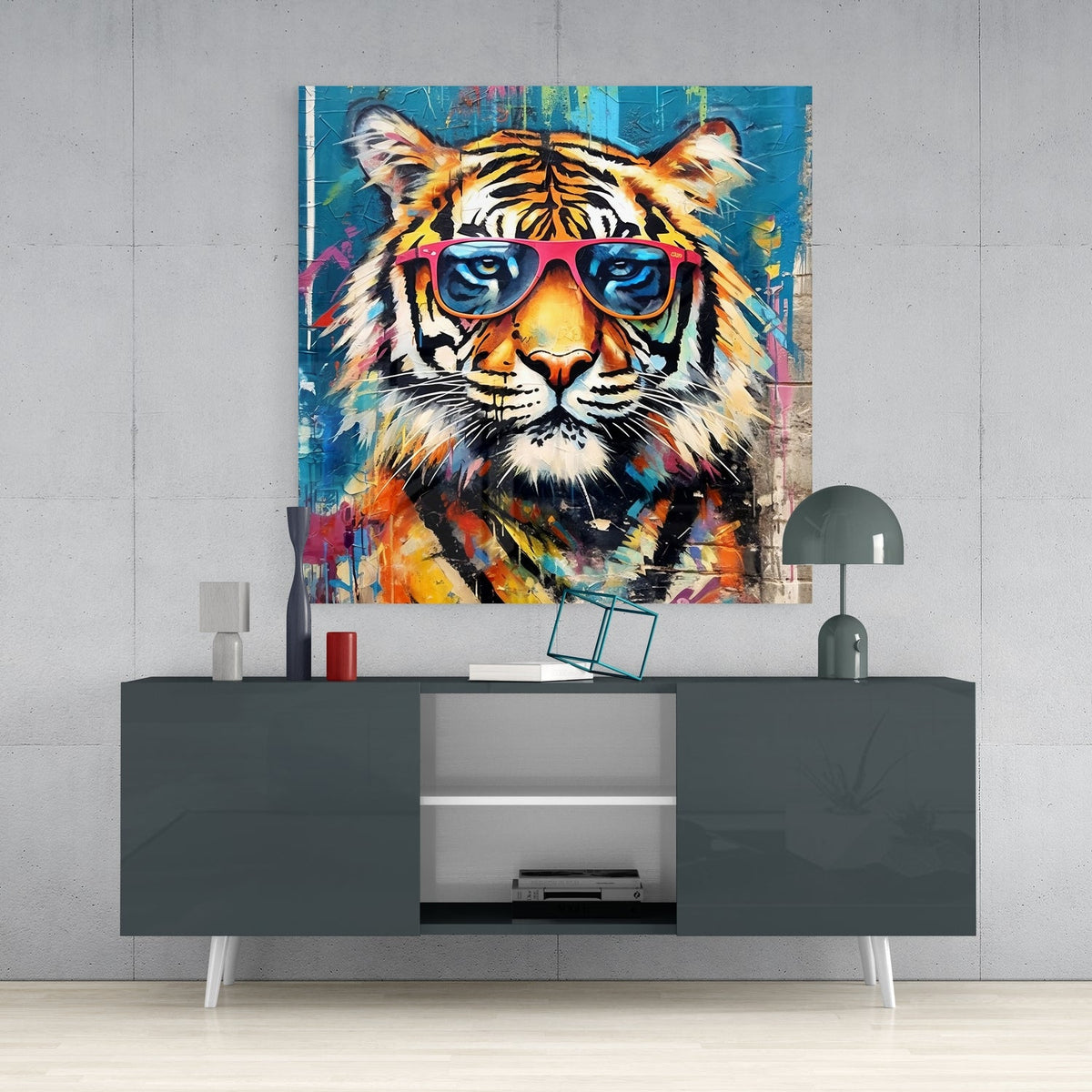 Tiger in pink sunglasses glass wall art on a concrete wall above a dark gloss sideboard with a dome lamp