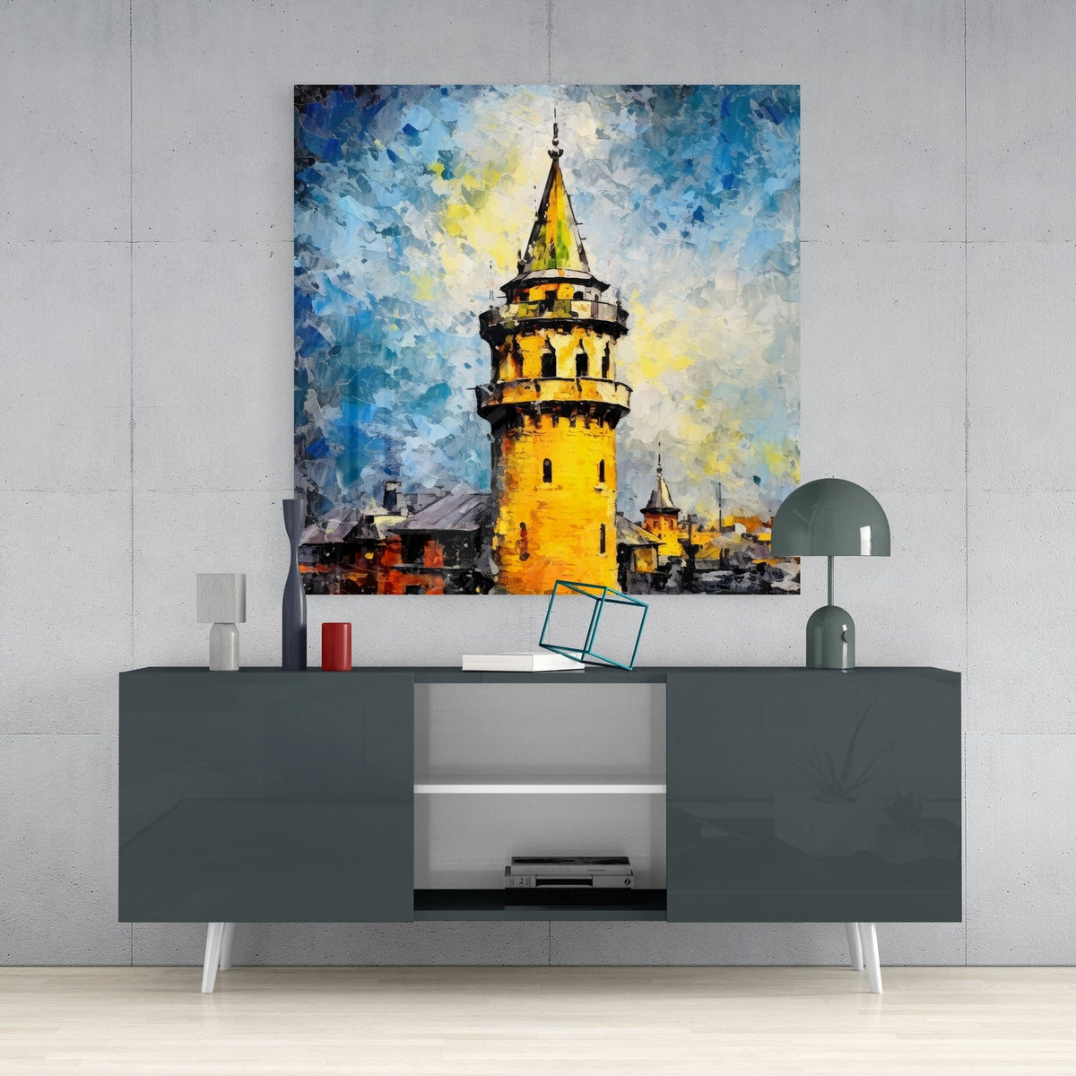 Golden Galata Tower glass wall art above a dark gray sideboard with a dome lamp and vase
