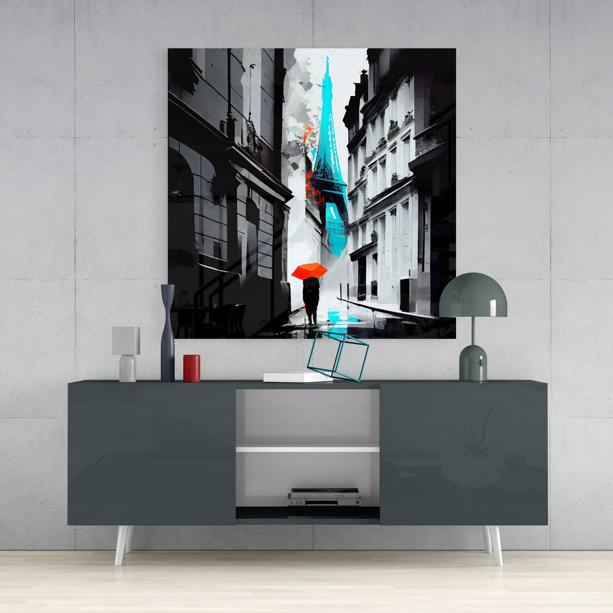 Paris alley with red umbrella glass wall art above a gray console with a small lamp