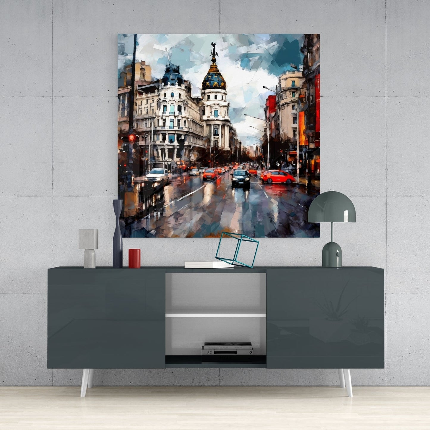 Rainy Spanish boulevard glass wall art on a light gray wall above a dark gray sideboard with a lamp