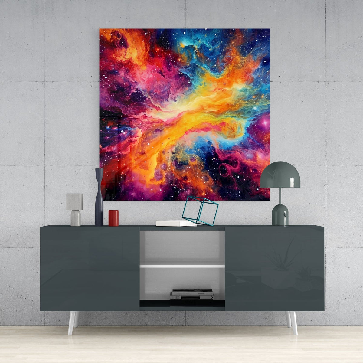 Rainbow nebula galaxy glass wall art above a gray sideboard with a vase, red candle and dome lamp