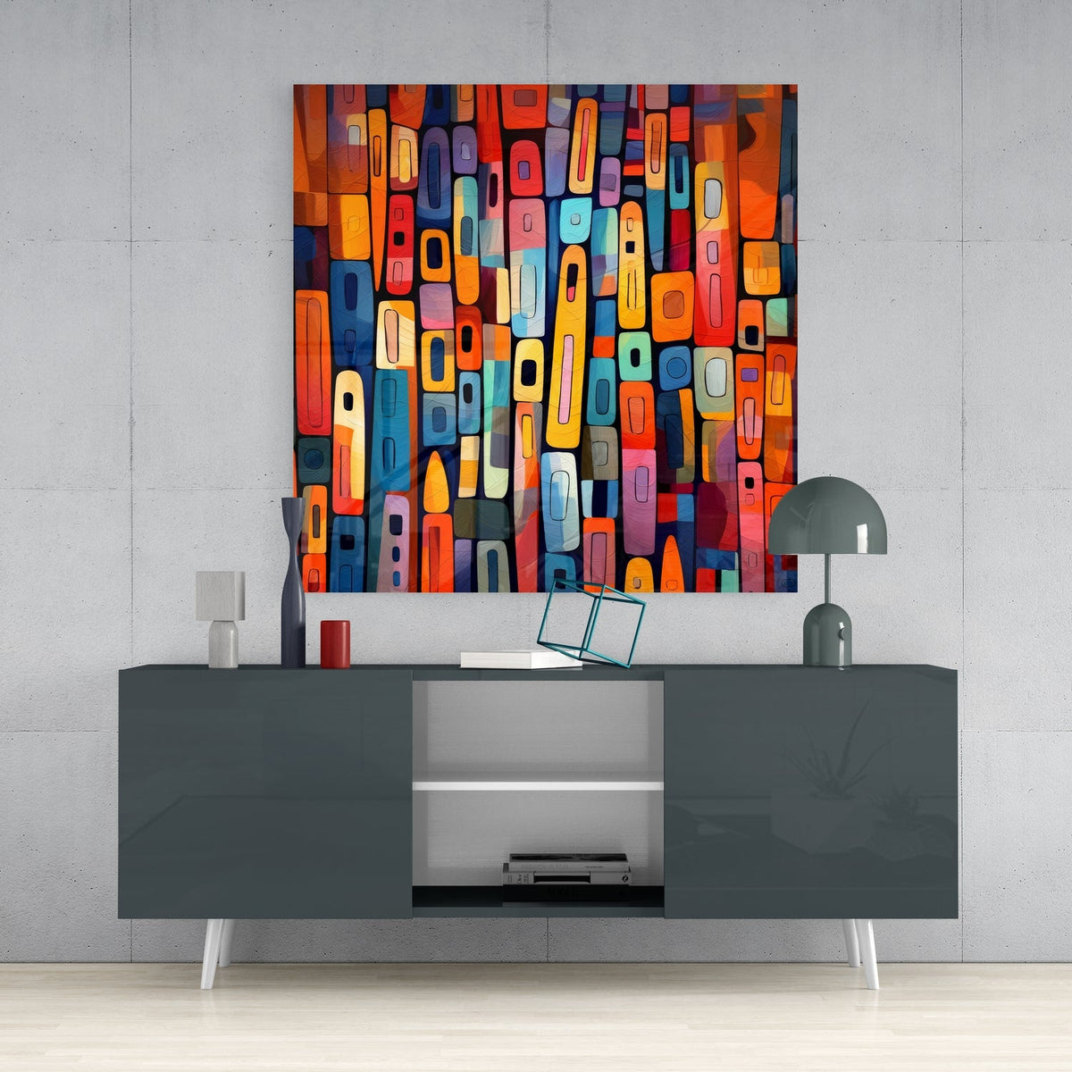 Colorful rounded blocks mosaic glass wall art above a gray console with a small lamp