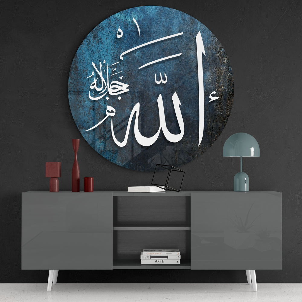Teal Allah calligraphy round glass wall art above a gray sideboard with red vases on a dark wall