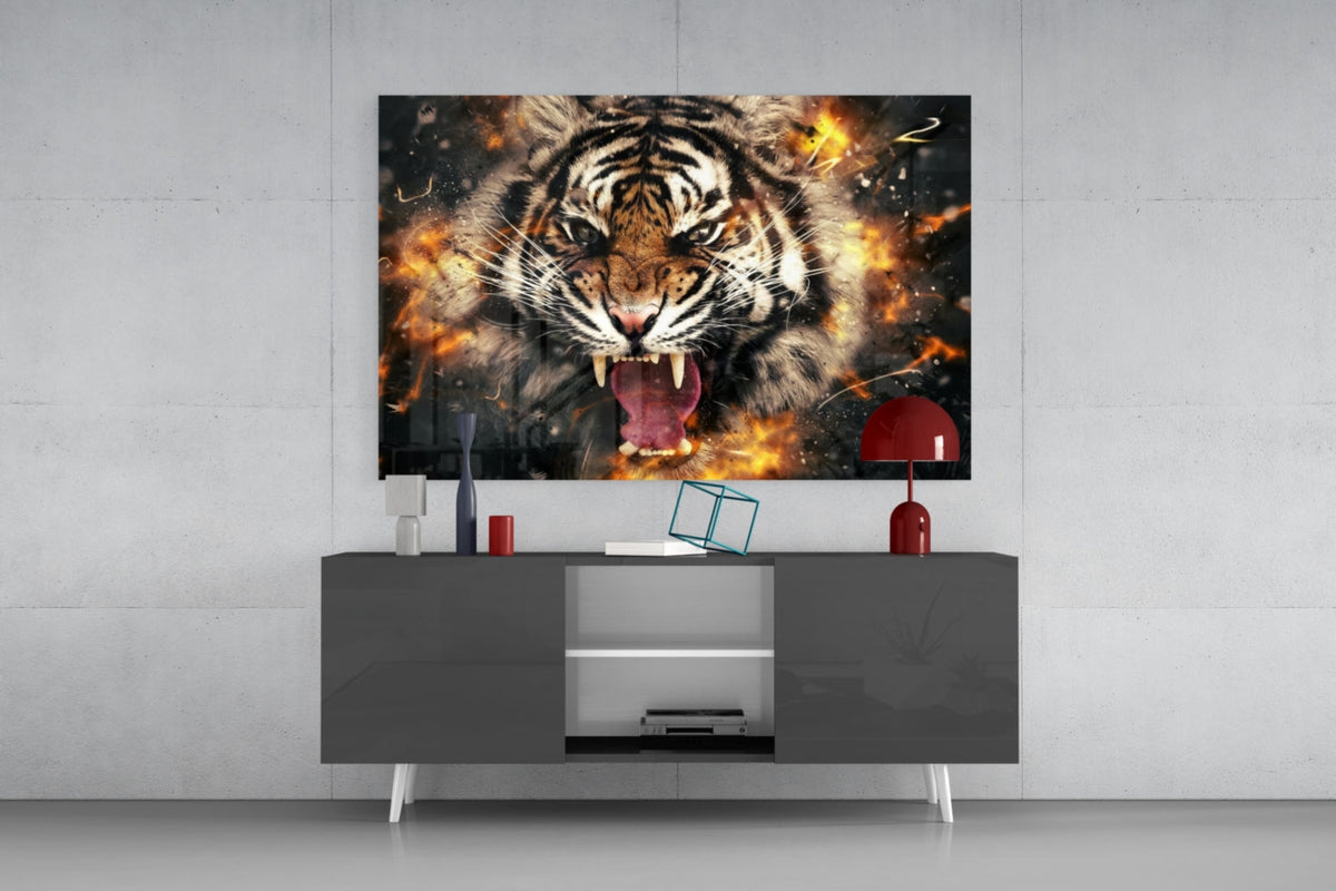 Roaring tiger in fire and sparks glass wall art above a gray sideboard with a red table lamp