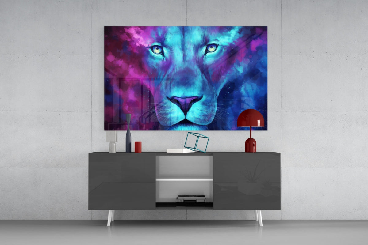 Blue and violet neon lion face glass wall art above a gray sideboard with a red lamp on a concrete wall