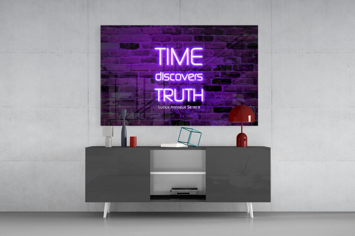 Time discovers truth neon quote glass wall art above a gray sideboard with a red table lamp