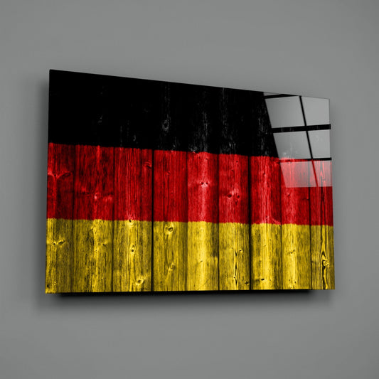 Germany wood plank flag glass wall art on a gray wall, light catching the glossy glass surface