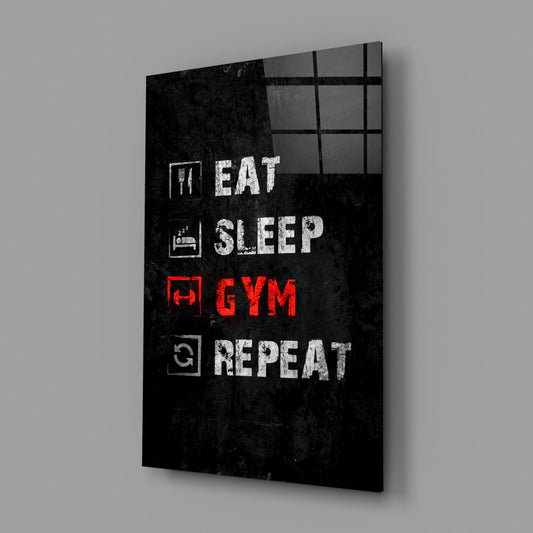 Eat sleep gym repeat glass wall art on a gray wall with a window reflection in the glossy front