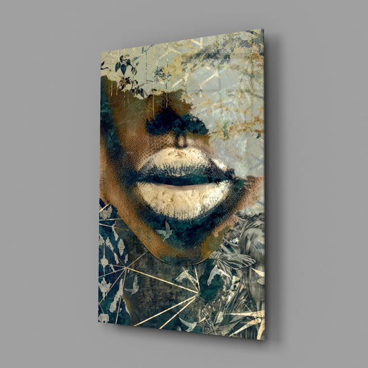 Lips with botanical overlay glass wall art on a gray wall, light reflecting off the glossy front