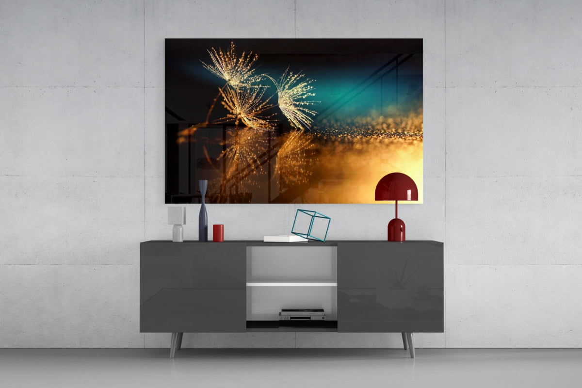 Golden dandelion glass wall art above a dark gray sideboard with a red dome lamp