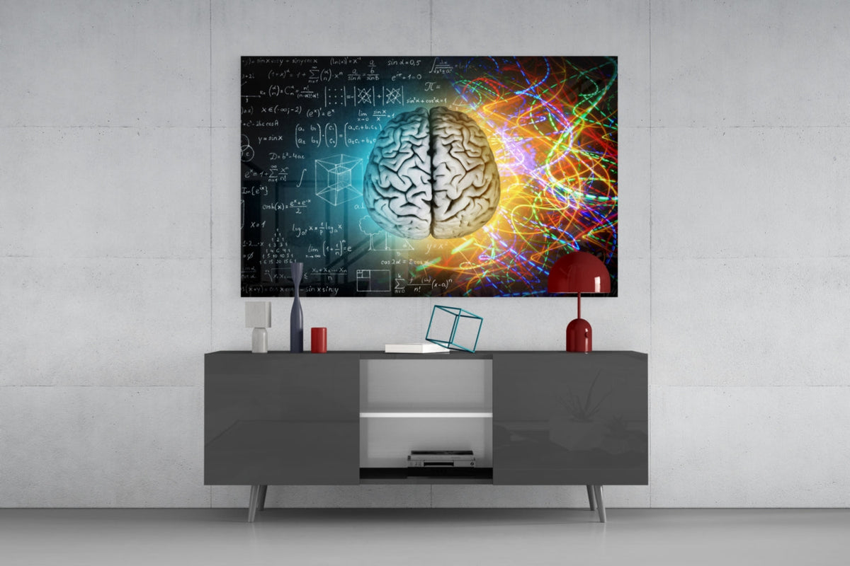 Left and right brain glass wall art above a gray sideboard with a red table lamp