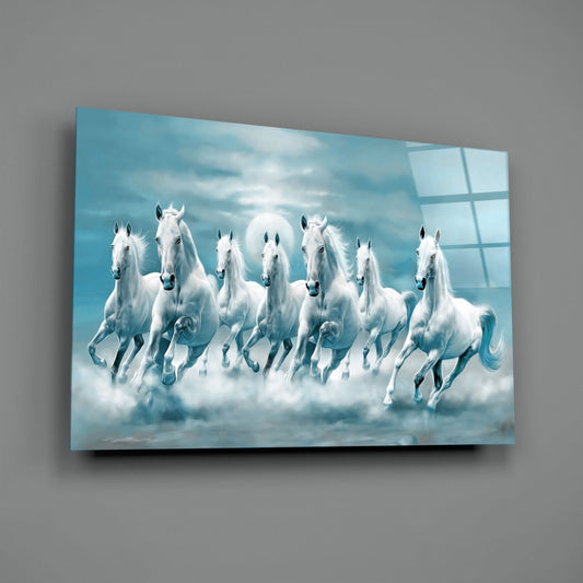 White horses in teal clouds glass wall art on a gray wall with a soft window reflection