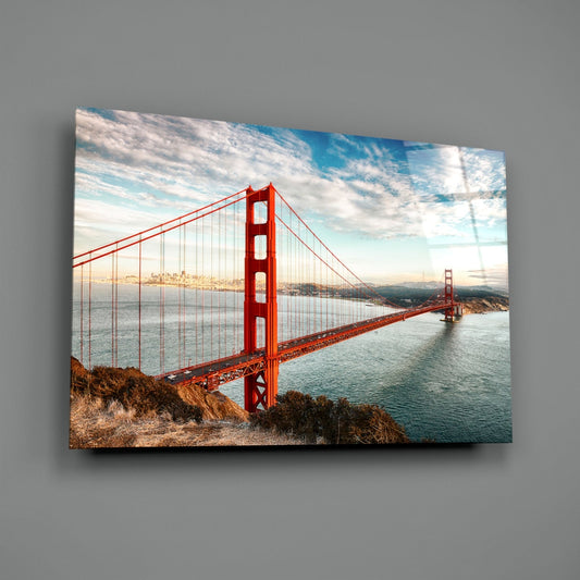 Golden Gate Bridge daylight glass wall art angled on a gray backdrop with light reflecting off the glossy front
