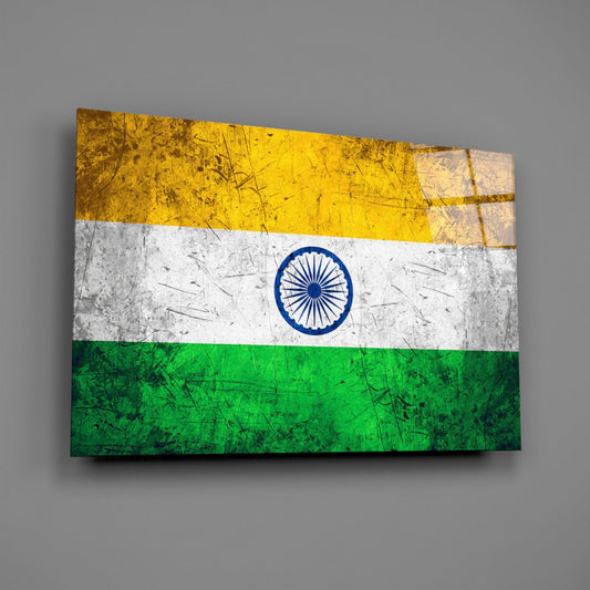 Weathered India tricolor flag glass wall art on a gray wall with a window reflection on the glass
