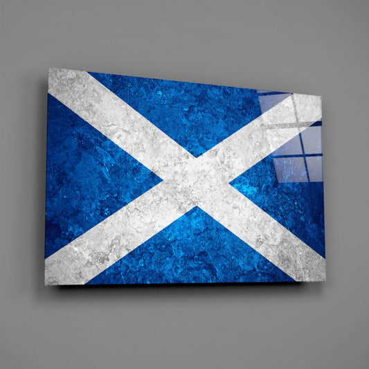 Deep blue marble Scotland flag glass wall art angled on a gray backdrop with light reflecting off the glossy front