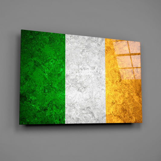 Weathered Ireland tricolor flag glass wall art on a gray wall with a window reflection on the glass