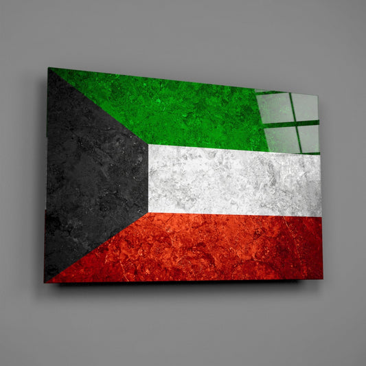 Weathered Kuwait flag glass wall art on a gray wall with a window reflection on the glass