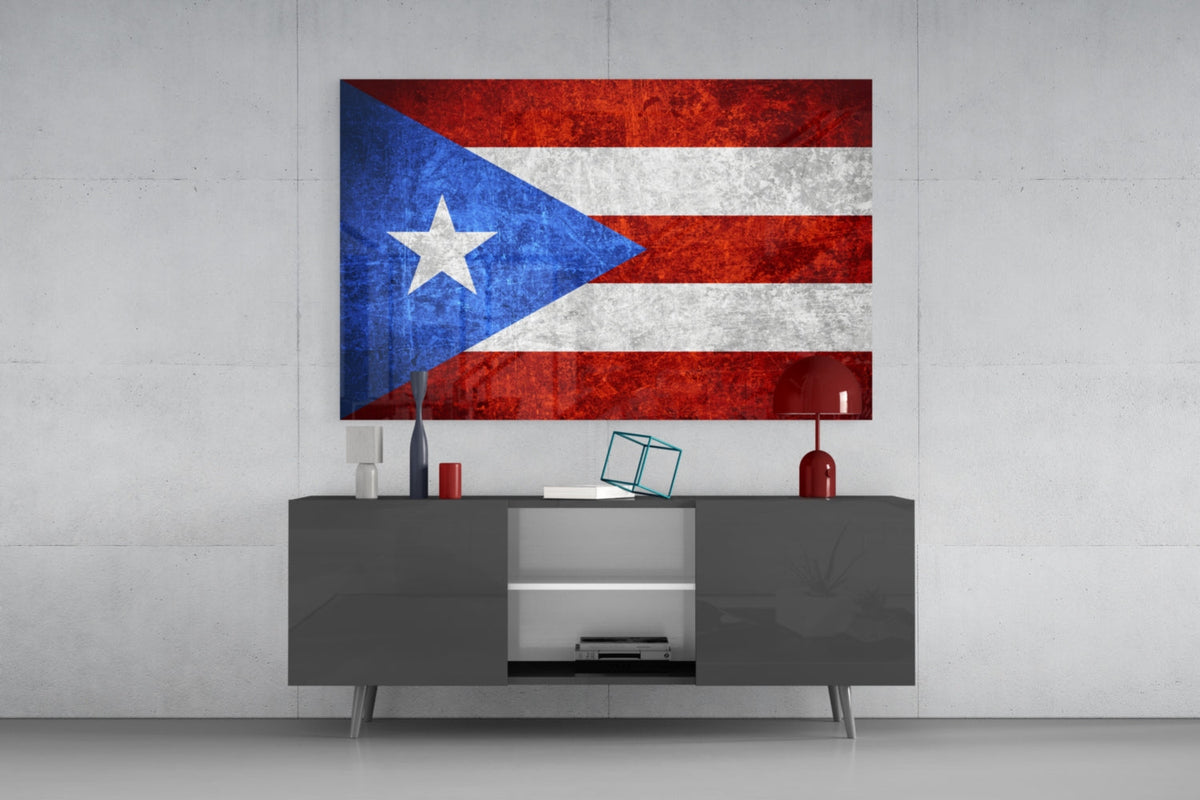 Dark grunge Puerto Rico flag glass wall art above a dark gray media console with a red table lamp