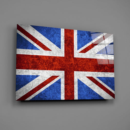 Chalky weathered United Kingdom flag glass wall art on a gray wall with a window reflection across the glossy glass