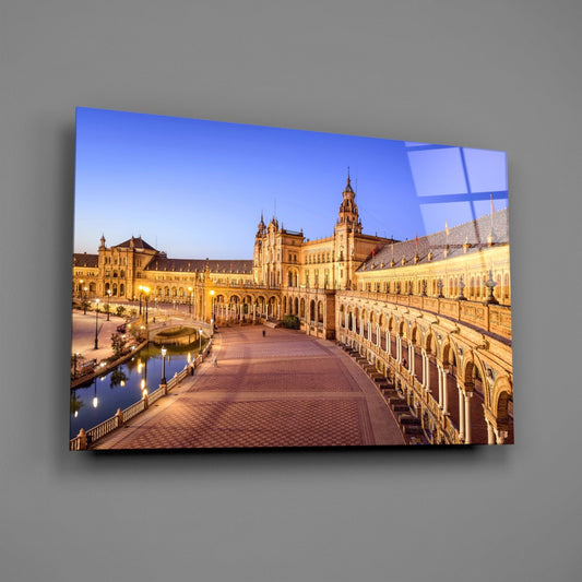 Plaza de Espana glass wall art on a plain gray wall, angled to show the glossy surface
