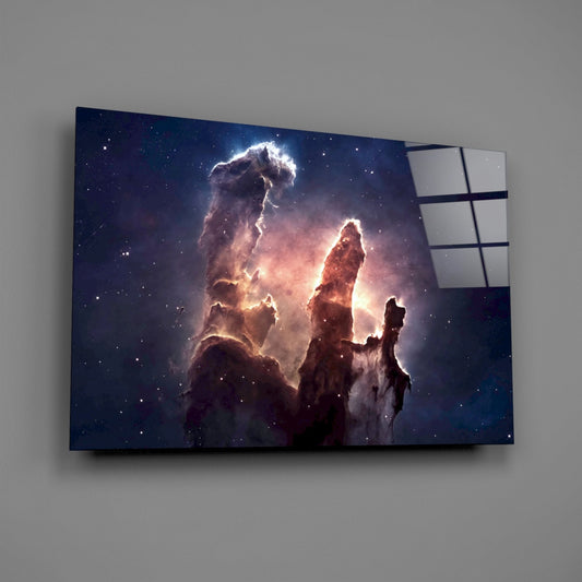 Nebula pillars glass wall art on a gray wall, light reflecting off the glossy front