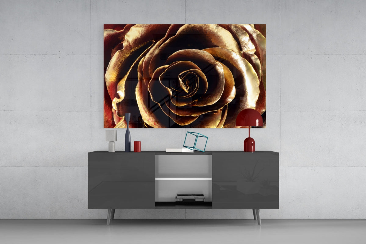 Golden metallic rose glass wall art above a dark gray sideboard with a red table lamp