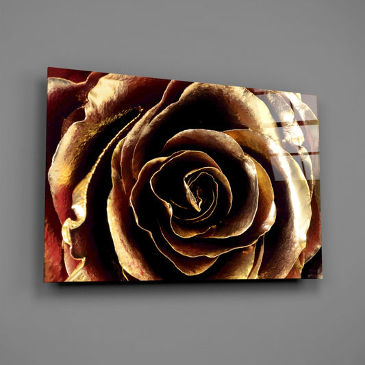 Golden metallic rose glass wall art on a gray wall with light reflecting off the glossy front