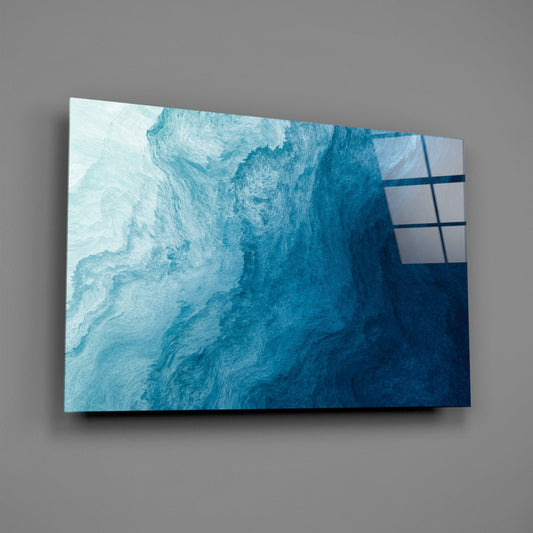 Teal to navy ombre glass wall art on a gray wall, light reflecting off the glossy front