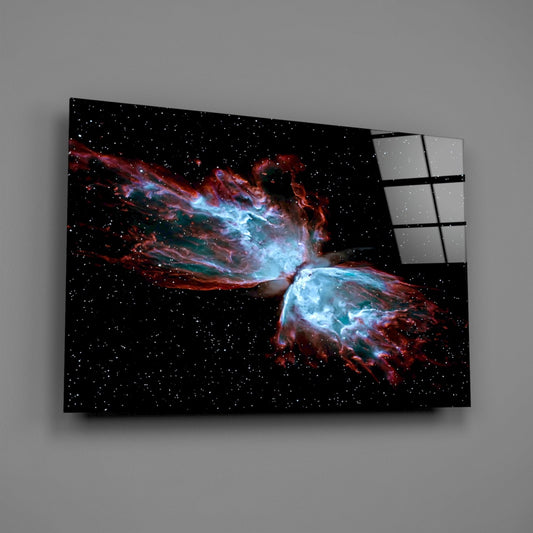 Butterfly nebula glass wall art on a gray wall, light reflecting off the glossy front