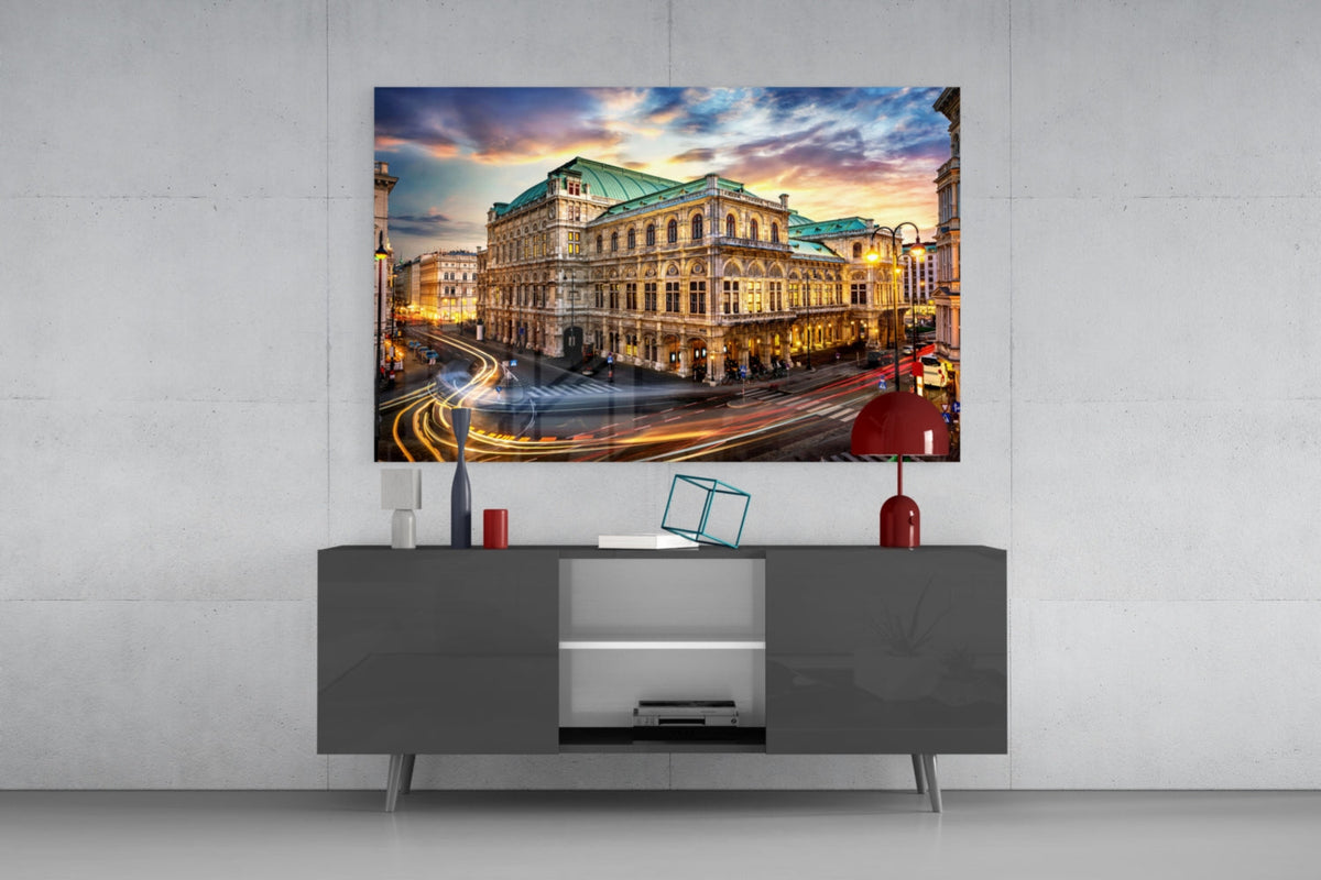 Vienna State Opera glass wall art above a gray sideboard with a red table lamp